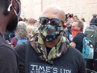 Man In A Camo Mask Protesting